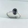 Detailed macro view of an adjustable stainless steel ring with an oval dark grey gemstone - 6x8mm Oval - Labradorite