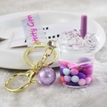 Kreativer Milchtee Schlüsselanhänger mit violetter Flüssigkeit und bunten Perlen - Lanyard-Stil / Lila