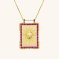 Detail of golden tarot square pendant with heart relief and pink zircon stones - Heart