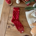 Red Christmas socks with white polka dots and velvet bow on wooden background - Red Polka Dot With Bowknot