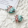 Macro detail of hand-painted blue and red ceramic goldfish beads for DIY jewelry making - Price per Piece / Blue with Red Patterns