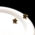 Detailed view of 3D gold-plated flower earrings with black enamel petals and metal frame - Black Gold Flower Ear Bone Stud (Single)