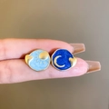 Detail showing vintage enamel sun and moon earrings with gold trim and silver needles - Star & Moon Theme (12)