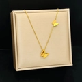Collana a farfalla in acciaio al titanio dorato con doppi pendenti a farfalla - Collana / Oro