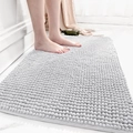 Plush grey chenille bath mat with non-slip texture on white bathroom floor tiles - Simple Time-Foggy Grey