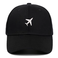 Black cotton baseball cap featuring white airplane embroidery on a classic curved brim hat - Adjustable / Black