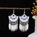 Bohemian silver earrings with blue turquoise stones and feather tassel charms - Blue
