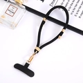 Detail of black nylon phone lanyard with gold metal clasp and T-shaped connector patch - Black