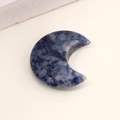 Blue natural stone moon pendant featuring unique white and dark blue sodalite marble patterns - Sodalite