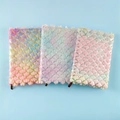 Three plush mermaid notebooks with gold scale patterns and colorful gradient fur textures - A5 Lined Pages / Wave Pattern (Tie-dye Multi)