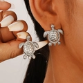 Silver sea turtle stud earrings with detailed shell texture on a model's ear - Silver Sea Turtle Embossed Stud Earrings (Sea Turtle Earrings N-166)