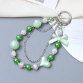 Acrylic green heart and bow beaded phone charm with white rhinestone balls and silver chain - Charm / Green