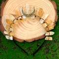 Detail of yellow crystal crown headband with moon charms on natural mossy wood - Citrine + Bronze Wire + Bronze Moon