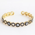 Adjustable golden evil eye cuff bracelet with deep blue zircons and enamel charms - Round Black