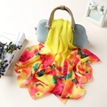 Lightweight chiffon scarf with butterfly floral print draped on a handbag - Butterfly Yellow