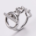 Macro shot of silver OT toggle clasp and Cuban link chain detail on a modern ring - US 6 / Steel
