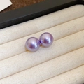 Elegant pair of round purple pearl stud earrings displayed on beige velvet - Round Style (Diameter 12mm) / Purple