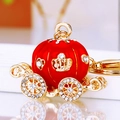 Sparkling red pumpkin carriage keychain with gold metal finish and rhinestone accents - Red Single-Sided