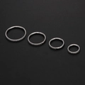 Detailed set of four 316L stainless steel clicker rings with inlaid sparkling zircons - 10mm / Silver