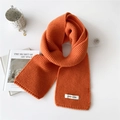 Orange knitted winter scarf for women featuring a minimalist thick woolen design - Orange