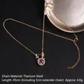 Collana in acciaio al titanio dorato con ciondolo a corna e zircone viola - Stile a Forma di Corna (紫锆17号A896)