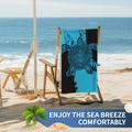 Microfiber beach towel with sea turtle print hanging on a beach chair by the ocean - B92-Artistic Rendering Turtle