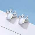 Elegant silver elk earrings with moonstone and rhinestones on a soft blue background - White Gold