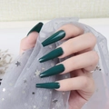 Macro detail of long coffin nails in deep green with high gloss mirror finish - Dark Green (CBLL-20)