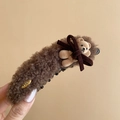 Close-up of brown plush teddy bear hair clip with velvet bow and golden metal detail - Twist Clip / Dark Coffee