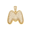 Gold-plated letter M pendant necklace with sparkling cubic zirconia pavé on white background - M