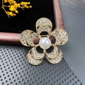Elegant gold flower brooch with white pearl center and sparkling crystals on mesh - BZ009 Hollow Fan Flower