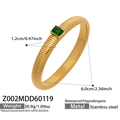 Golden ribbed stainless steel cuff bracelet featuring a rectangular green zircon stone - 1.2cm Wide / Gold with Green Zircon