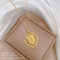 Golden Virgin Mary necklace with crystal frame on beige box and white silk fabric - Large Virgin Mary Rays Style (A132)