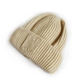Kids warm beige cable knit beanie featuring a prominent embroidered letter N patch - Beige