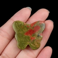 Unakite butterfly stone carving held in hand showing size and red green texture - Unakite / 30*35mm No Hole