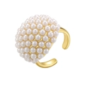 Detailed close-up of a golden dome ring featuring encrusted pearls and an adjustable band - Gold Oval