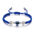 Adjustable blue braided evil eye bracelet with silver metal beads on white background - Flower / Blue
