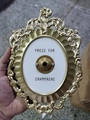 Detailed view of ornate gold vintage Press For Champagne decorative doorbell sign - Upgraded