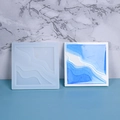 Detail of square silicone mold and resin island coaster with blue wave texture - Style 03