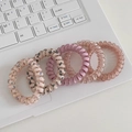 5-piece set of floral and solid elastic spiral hair ties on a white laptop keyboard - 6# Pink Spiral (5pcs Set)