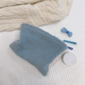 Close-up of soft blue sherpa fleece makeup bag on a cozy knitted texture background - Light Blue