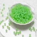 6mm light green translucent handmade glass beads in a white shell-shaped porcelain dish - Light Green Chalcedony Beads (6mm)