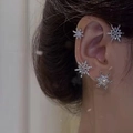 Silver snowflake earrings and ear cuff set with pavé rhinestones worn by a model - Snowflake Earring Set / 13# Silver Snowflake - Right Ear