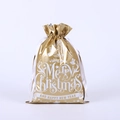 Close-up of golden drawstring gift bag with white Merry Christmas lettering and ribbons - 42*29 Gold Text