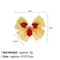 Christmas bow decoration with gold mesh and red holly leaves measuring 6x5x2.5cm - Christmas Bow 21