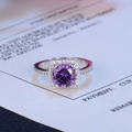 Macro detail of silver ring with purple center stone and surrounding diamond accents - Purple Diamond (Square Halo)