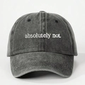 Detail shot of 'absolutely not.' white embroidery on a washed dark grey cotton baseball cap - Black