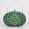 Detailed macro view of green crystal flower clutch with gold frame and spherical clasp - Green