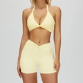 Women's pale yellow yoga set with twist front sports bra and high waist shorts - M / Top And Bottom / Bra + Shorts / Creamy Yellow