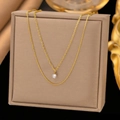 Double layered gold plated titanium necklace featuring a sparkling round cubic zirconia pendant - Solitaire Double Layer / Gold
